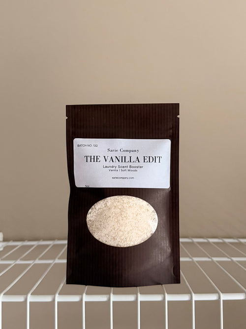 The Vanilla Edit sampler pouch on a beige background, with a white shelf