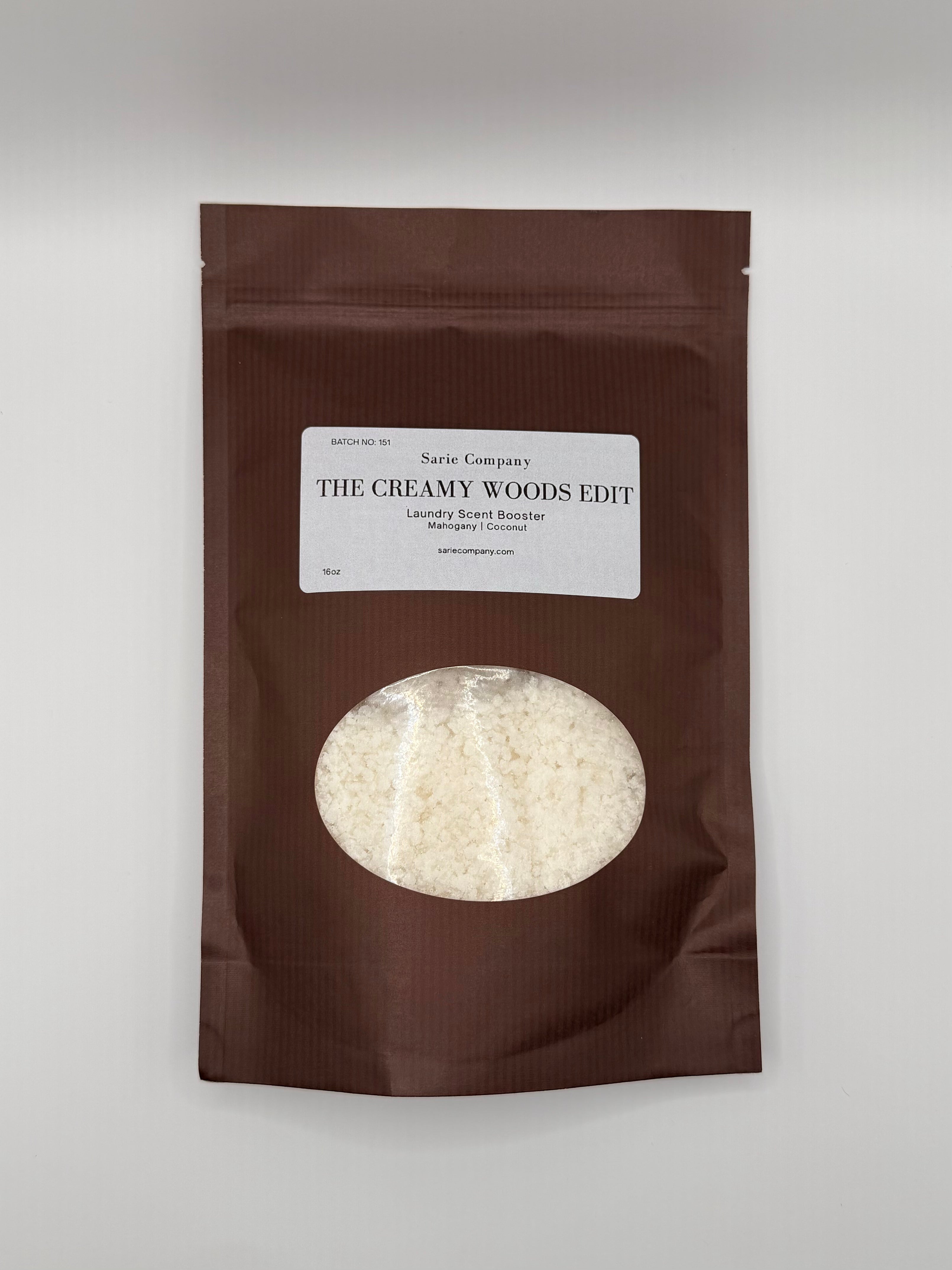 Brown package with a label titled 'The Creamy Woods Edit' on a white background.