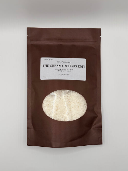 Brown package with a label titled 'The Creamy Woods Edit' on a white background.