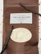 Sarie Company laundry scent booster package with vanilla beans and a vanilla pod on a white background